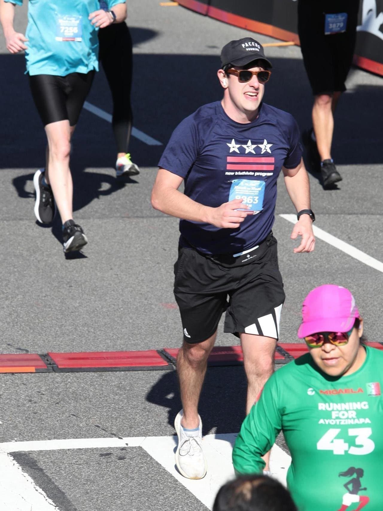 crossing the finish line of the Rock n Roll DC Half Marathon